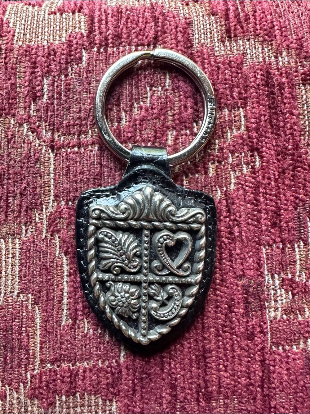 Silver-Tone Shield Keychain with Embossed Motif